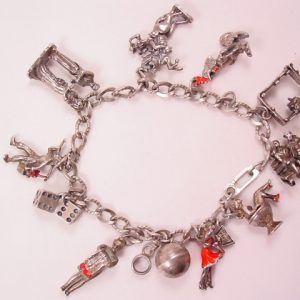 Old Charm of a Charmer Bracelet - Some Sterling
