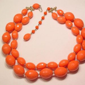 Double Strand Coral Colored Plastic Necklace