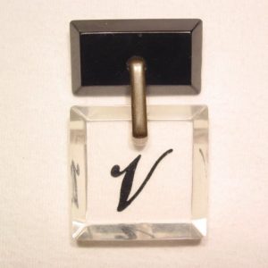 Lucite and Black Plastic “V” Pin