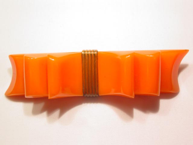 Bright Orange Bakelite Ribbon Pin