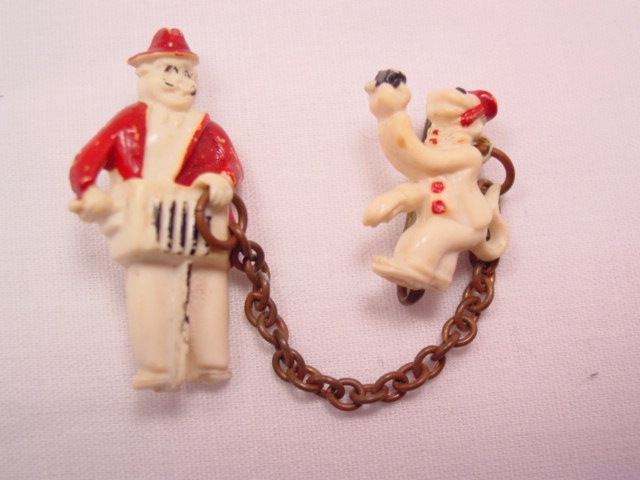 Old Plastic Organ Grinder and Monkey Sweater Pins